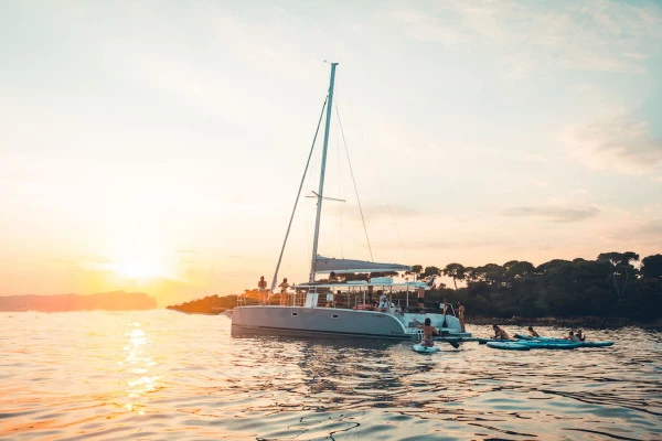 PRIVATE Catamaran trip + Stand Up Paddle - SUNSET - Bonjour Fun